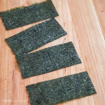 For the nori sheets, the amount used is personal preference. If you prefer more dry roasted seaweed, use two nori sheets and cut them into half so you have 4 pieces. If you prefer less nori, use half a sheet and cut them into 4 equal strips. Set aside.