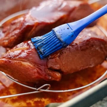 Remove the pork from the oven and baste ensuring all of the pork is covered in the glaze. Bake for 10 minutes