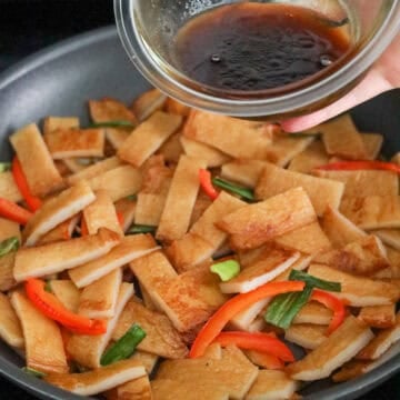 Pour the sauce over the fish cakes and mix well. Cook for about 30 seconds. Remove off heat.