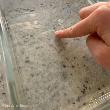 In a 8 x 6 inch rectangle container, scoop ½ cup or 125 ml of the lychee liquid and pour into the container, keeping the rest warm and covered. Let this layer set at room temperature. To check if it's set, it should be firm to touch.