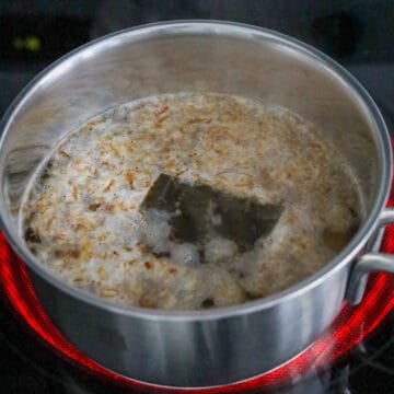 Next in a small pot, add cold water, dried kelp and bonito flakes. Then cover and bring to boil on medium-high heat, uncovered.