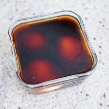 Pour the room temperature broth over the eggs.