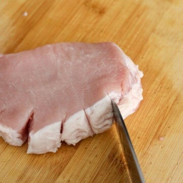 make small slits into the layer of fat