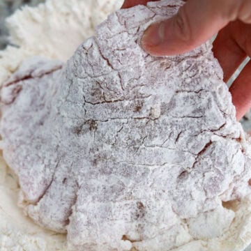 coat pork into flour