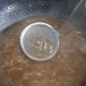 Pour in water (or stock). Cover and bring to a boil. Then reduce to medium-low heat for 15 minutes for a gentle boil. Skim off any scum for a clean broth.