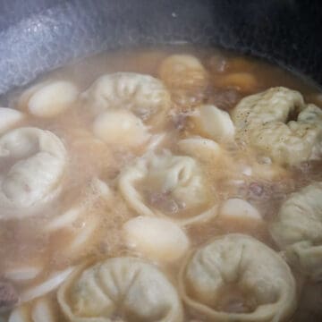 Uncover and add in dumplings and rice cakes. Bring to a boil over medium high heat. Cook until they float, about 3-4 minutes. Remove the soup off heat. Note: If using large dumplings, cook them 4 minutes earlier than the rice cake as they’ll take longer to cook.