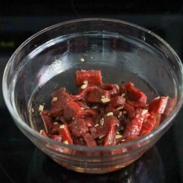 Dice beef into small cubes. Transfer to a small bowl. Season beef with Marinade ingredients and set aside to marinate for 2-3 minutes.