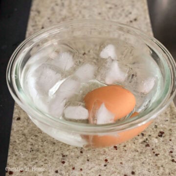 submerge cooked egg into an ice bath until cooled down