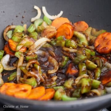 Pour in prepared stir fry sauce. Toss everything together and allow sauce to simmer to thicken.