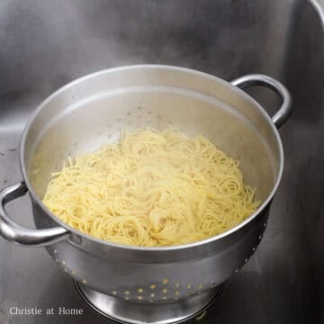 Blanch noodles in hot boiling water just until loose and strain well.