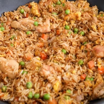 Add rice and chicken and toss everything together until incorporated. Pour sauce around the rice or along the edges of the pan and let the sauce toast for 5 seconds for extra flavor before tossing. Toss everything together until all the rice grains are brown. Enjoy!