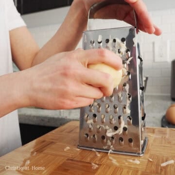 Using a box shredder or food processor, shred peeled potatoes and peeled onion using the larger setting.