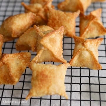 Remove the fried wontons from the oil, shaking off any excess oil. Then drain on a wired rack or a paper towel-lined plate and let them cool down a bit before serving with suggested dipping sauce.