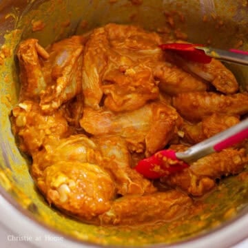 Then add the remaining seasoning ingredients into the bowl, with potato starch being the last ingredient. Mix the wings into the seasoned coating until well coated.