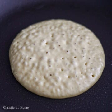 Cook the pancake on the first side for 3-4 minutes or until bubbles form all over the pancake and the bottom is golden brown.