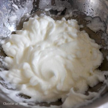 Now beat the egg whites with a whisk or electric hand mixer until you have stiff peaks. To know if they're stiff, dip the whisk or beater into the egg whites and when you raise it, there should be a a stiff tail that doesn't wiggle too much.