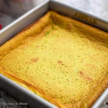 Bake the cake on the middle rack for 60-65 minutes. At the 30 minutes, cover loosely with aluminum foil. The cake will be cooked when an inserted toothpick comes out clean. If not, cover and bake for another 10 minutes. Once baked, remove from the oven and leave the cake in the pan for 10 minutes. Run a knife along the edges of the cake and transfer to a wire rack to cool down. Slice and sprinkle icing sugar over top to enjoy!