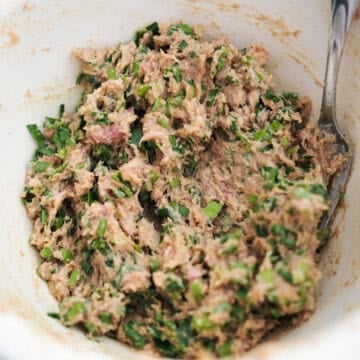 In a large bowl, add wonton filling ingredients as listed. Mix the ingredients in one direction for about 1-2 minutes with a pair of chopsticks or a fork until the minced meat becomes a sticky paste.