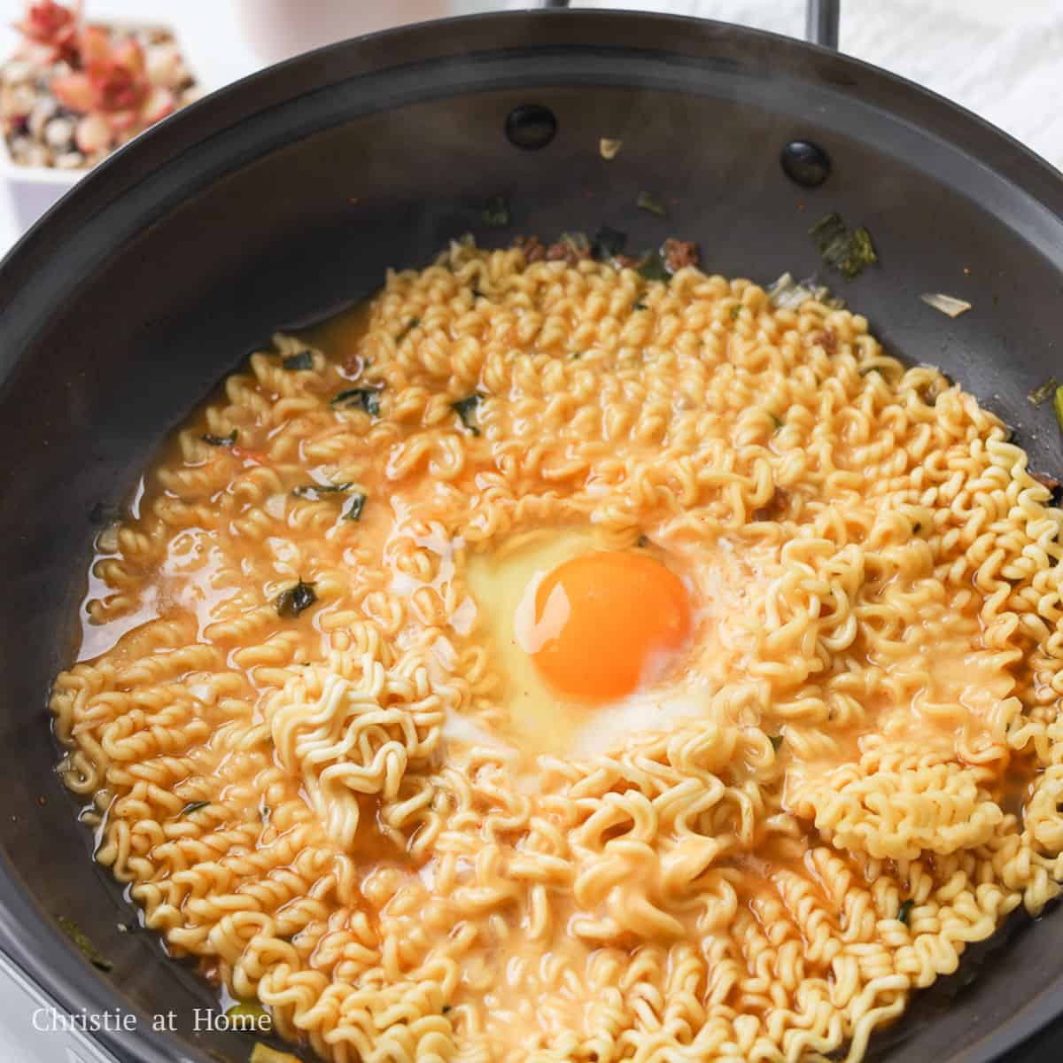 Cook noodles for another 1 minute until cheese has melted and mix to enjoy!