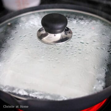Cover with a lid and steam for 4 minutes until you see large bubbles form under the rice noodle sheet. Do not open the lid.
