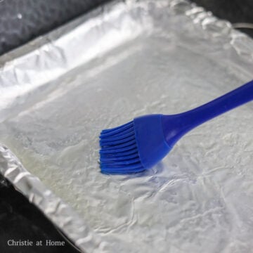 In a large wok, fill it one-third of the way with water and place a wire rack or a bamboo steamer on top of the water. Place a 10 x 8-inch baking tray onto the wire rack or bamboo steamer and ensure it's perfectly levelled or batter will pool in certain areas creating a uneven texture. Brush 1 teaspoon of vegetable oil on the tray. Then bring the water to boil over medium-high heat.