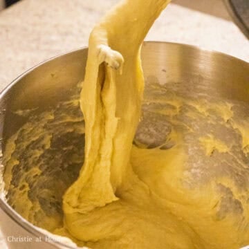 Remove the dough from the mixing bowl and knead for 15-30 minutes until it’s smooth and not as tacky by hand or in a stand mixer. The dough should have an elastic stretchy feel with a slight sticky feel.