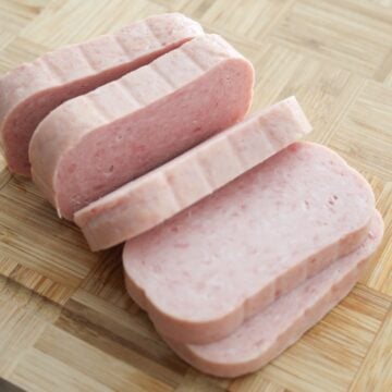 Lay spam on a clean surface. Cut spam into 5 equal pieces for the perfect thickness. Clean and reserve the spam can for later.