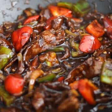 Simmer the sauce and toss in the cooked beef.