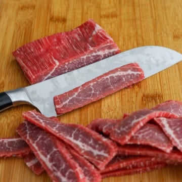 Slice flank steak on a bias into thin strips.