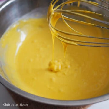 Next mix in your egg yolks into the batter, followed by the rest of the milk. The batter should be a bit runny. Set aside.