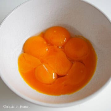 Separate the egg yolks from the egg whites. Place the egg whites in a larger mixing bowl for later. The egg yolks can be placed in a smaller bowl. Set aside.