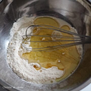 Heat vegetable oil in a heatproof bowl in the microwave for 80 seconds until it's 90 degrees C using digital instant read thermometer or heat the oil in a small pot until it reaches the same temperature. Then immediately pour the hot oil into the flour mixture and mix well. Add in half the portion of the milk into the flour mixture and mix until combined.