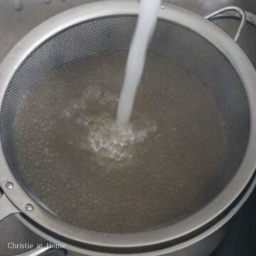 Strain cooked tapioca in a fine sieve and rinse under cold running water. Strain out as much excess water as possible.