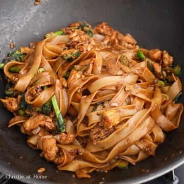 Add in remaining vegetable oil, fresh rice noodles and noodle sauce and toss until noodles are evenly coated. Add cooked chicken. Toss everything until combined and all the sauce has absorbed into the noodles. Char the noodles in the pan for 30-60 seconds for extra flavor. Serve and enjoy!