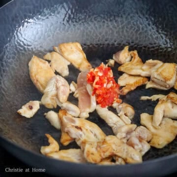 Add chili garlic paste and mix with chicken.