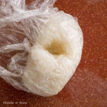 Poke a hole at the top of the triangular shaped rice ball with your thumb. Set aside.