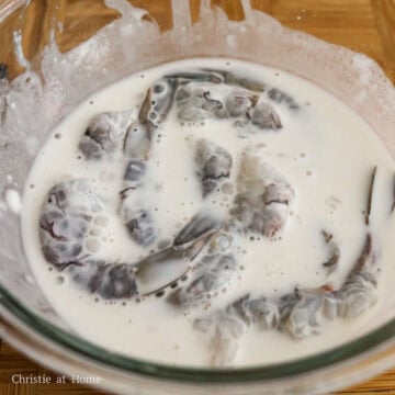 In a medium bowl, whisk together the tempura batter ingredients as listed above until smooth and runny. Then mix shrimp into the batter ensuring it's fully coated.