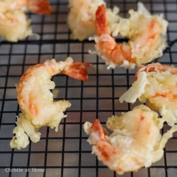 Remove with tongs or a slotted spoon and transfer to a wire rack or paper towel baking sheet to allow excess oil to drip off.