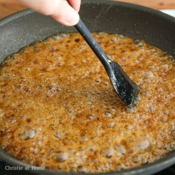 Into the pan, add the sauce and scrape the brown bits on the bottom. Simmer for 2 minutes stirring occasionally until slightly thickened.