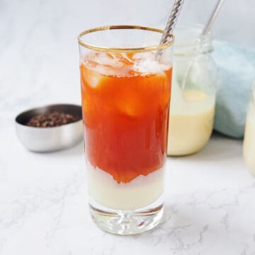 Next once the black tea is steeped, pour into the tall glass.