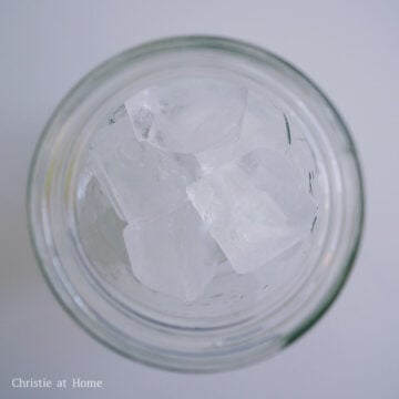 Add ice cubes and 1 cup of the oat milk into your serving glass. Set aside.