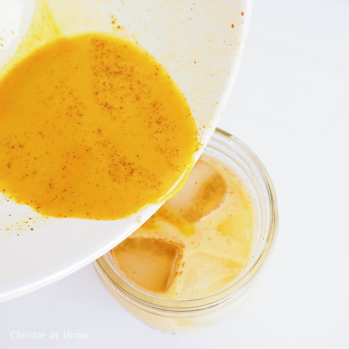 Pour the yellow liquid into your glass with milk and ice. Mix and enjoy cold!