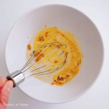 In a small bowl or measuring cup with a lip, whisk together remaining ½ cup of oat milk, maple syrup, ground turmeric, cinnamon, ginger, black pepper and vanilla extract until smooth.