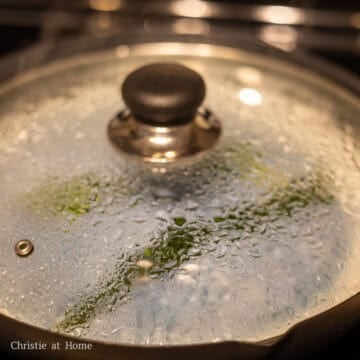 Cover and steam the blue rice for 25 minutes. Occasionally checking it to ensure there's enough water in the steamer and refill with hot water if needed. Remove the plate from steamer with oven mitts and remove the pandan leaves from the rice. Keep the rice warm.