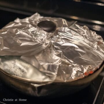 Steam over medium heat for 30 minutes covered using a lid covered in aluminum foil or a clean tea towel. This prevents the water droplets from making holes into your pandan custard layer.