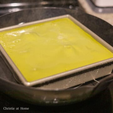 Finally remove the baking pan from steamer with oven mitts and let the cake cool down inside the baking pan. Then slice the cake with a wet and oiled knife at an angle and serve to enjoy!