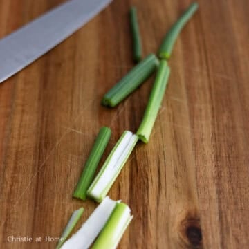 Wash green onions and pat dry. Slice them vertically and chop into 2-inch-long pieces.