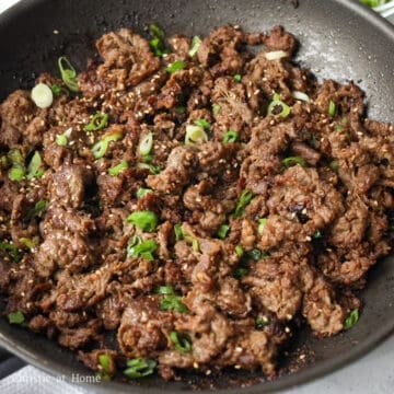 Garnish with sesame seeds and green onions. Remove off heat and enjoy!