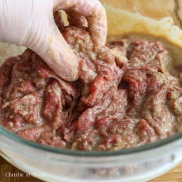 In a large bowl, add thin slices of beef and pour the marinade over top. Gently mix until the marinade has thoroughly coated the meat with clean hands - do not be rough or the beef can break apart. Marinate for 30 minutes at room temperature or up to 1 hour or overnight in the fridge.