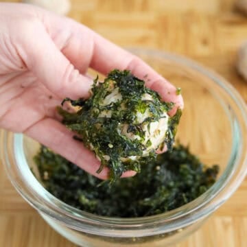 coat rice balls with seaweed seasoning